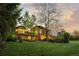 Stunning exterior view with well-manicured lawn and beautiful architectural details at 700 Utica Ave, Boulder, CO 80304