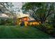 Expansive front lawn highlights this well-maintained home with professional landscaping and mature trees at 700 Utica Ave, Boulder, CO 80304