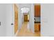 Hallway with hardwood floors, built-in cabinets and view of the front door at 700 Utica Ave, Boulder, CO 80304