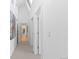 Bright hallway with skylights and open doorways at 700 Utica Ave, Boulder, CO 80304