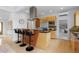 Kitchen with stainless steel appliances, a granite counter, and a breakfast bar with seating at 700 Utica Ave, Boulder, CO 80304