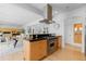Modern kitchen with a large island, stainless steel appliances, and an open layout at 700 Utica Ave, Boulder, CO 80304
