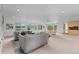 Large living room with lake views, neutral decor, and a cozy seating area at 700 Utica Ave, Boulder, CO 80304