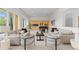 Spacious living room with lots of natural light, a fireplace, and neutral decor at 700 Utica Ave, Boulder, CO 80304