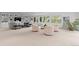 Spacious living room with plush seating, a large window and built-in shelving at 700 Utica Ave, Boulder, CO 80304