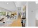 Bright, open-concept living space with elegant decor, wood floors, and lots of natural light at 700 Utica Ave, Boulder, CO 80304