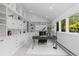 Bright office space with built-in shelving and cabinets plus a large window at 700 Utica Ave, Boulder, CO 80304
