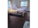 Cozy bedroom with a comfortable bed, soft natural light, and view of yard at 245 Lower Glenway St, Palmer Lake, CO 80133