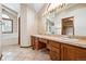 Bathroom showcasing a double vanity, large mirror, a tub and a shower at 5395 S Flanders Way, Centennial, CO 80015