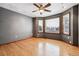 Bright bedroom featuring hardwood floors, a ceiling fan, and multiple windows letting in lots of natural light at 5395 S Flanders Way, Centennial, CO 80015