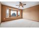 Spacious bedroom with a ceiling fan and a large bay window offering natural light and outdoor views at 5395 S Flanders Way, Centennial, CO 80015