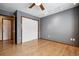 Bedroom showcasing a large closet and beautiful hardwood floors at 5395 S Flanders Way, Centennial, CO 80015