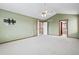 Bedroom featuring a ceiling fan and views of the hallway at 5395 S Flanders Way, Centennial, CO 80015