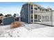 Rear exterior showcasing the home's siding and backyard with patio and sheds at 5395 S Flanders Way, Centennial, CO 80015