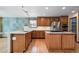 Kitchen featuring wood cabinets, granite counters and stainless steel appliances at 5395 S Flanders Way, Centennial, CO 80015