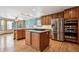 Kitchen featuring wood cabinets, granite counters and stainless steel appliances at 5395 S Flanders Way, Centennial, CO 80015