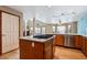 Kitchen island with granite countertop, stainless steel appliances and ample cabinet space at 5395 S Flanders Way, Centennial, CO 80015