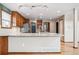 Kitchen island with granite countertop, stainless steel appliances and ample cabinet space at 5395 S Flanders Way, Centennial, CO 80015