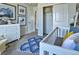 Cozy Bedroom features a crib, dresser, and charming decor with mountain and animal-themed artwork at 834 N Bently St, Watkins, CO 80137