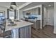 Kitchen featuring stainless appliances, bar seating, and wooden cabinets at 834 N Bently St, Watkins, CO 80137