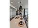 Bright, open kitchen with a large center island featuring bar seating and stainless appliances at 834 N Bently St, Watkins, CO 80137