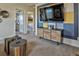 Upstairs living room with cozy seating, stylish decor, and entertainment setup create a relaxing space at 834 N Bently St, Watkins, CO 80137