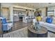 Inviting living space features open kitchen, modern fixtures, and cozy seating area for relaxation and entertaining at 834 N Bently St, Watkins, CO 80137