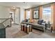 Upstairs living room features stylish decor, plush seating, and scenic views for ultimate relaxation at 834 N Bently St, Watkins, CO 80137