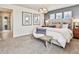 Serene bedroom featuring plush bedding, natural light, and contemporary decor for a comfortable retreat at 834 N Bently St, Watkins, CO 80137