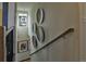 Open staircase with decorative wall plates and natural light enhance the architectural detail at 834 N Bently St, Watkins, CO 80137