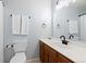 Bathroom featuring vanity, mirror, toilet, and towel rack at 13648 W 66Th Way, Arvada, CO 80004