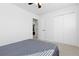Bedroom featuring carpet, ceiling fan, light walls, and closet at 13648 W 66Th Way, Arvada, CO 80004