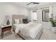 Cozy bedroom featuring ample natural light, a ceiling fan, and a neutral color palette at 2230 W 36Th Ave, Denver, CO 80211