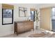 Bedroom featuring a wooden dresser with decor, bright windows, and hardwood floors at 2230 W 36Th Ave, Denver, CO 80211