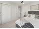 Serene bedroom with minimalist decor, light carpet, and closet space at 2230 W 36Th Ave, Denver, CO 80211