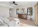 Spacious bedroom featuring a wooden dresser with decor, bright windows, and hardwood floors at 2230 W 36Th Ave, Denver, CO 80211