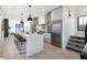 Sleek kitchen featuring a large island, stainless steel appliances, and contemporary design at 2230 W 36Th Ave, Denver, CO 80211