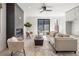 Stylish living room featuring a modern fireplace, neutral decor, and ample natural light at 2230 W 36Th Ave, Denver, CO 80211