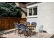 Backyard patio showcases a dining area with seating for six, ideal for outdoor entertaining at 1185 S Steele St, Denver, CO 80210