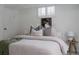 Stylish bedroom with neutral tones, a comfortable bed, and attractive decor creates a serene retreat at 1185 S Steele St, Denver, CO 80210