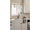 Bright kitchen featuring modern fixtures, stainless steel appliances, a window, and neutral color palette at 1185 S Steele St, Denver, CO 80210