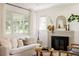 Bright living room with a fireplace, lots of natural light and modern decor at 1185 S Steele St, Denver, CO 80210