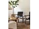 Living room featuring hardwood floors, two chairs, and decorative table at 1185 S Steele St, Denver, CO 80210
