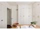 Home office with built-in storage cabinets, a wooden desk, and hardwood floors at 1185 S Steele St, Denver, CO 80210