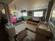 Finished basement with carpet, windows, and entertainment area at 4449 S Xavier St, Denver, CO 80236