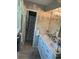 Elegant bathroom with double vanity, marble countertop, and decorative lighting at 4449 S Xavier St, Denver, CO 80236