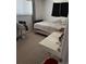 Bedroom with simple decor, a single bed, and a work desk with a view from the bright window at 4449 S Xavier St, Denver, CO 80236