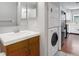 Bathroom with a single sink and stacked washer and dryer at 3600 S Pierce St # 2-201, Lakewood, CO 80235