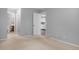 Bedroom with neutral walls, carpet, and views of the kitchen and bathroom at 3600 S Pierce St # 2-201, Lakewood, CO 80235