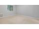 Bedroom with neutral walls, carpet, and a window for natural light at 3600 S Pierce St # 2-201, Lakewood, CO 80235
